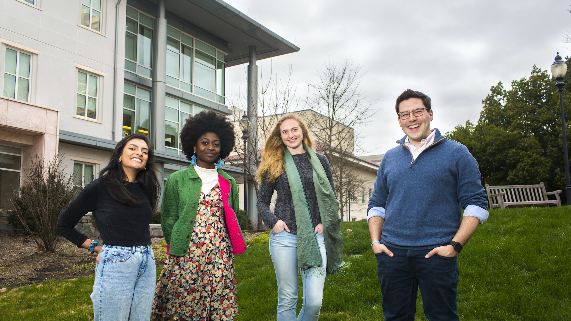 group of students on lawn outside of building