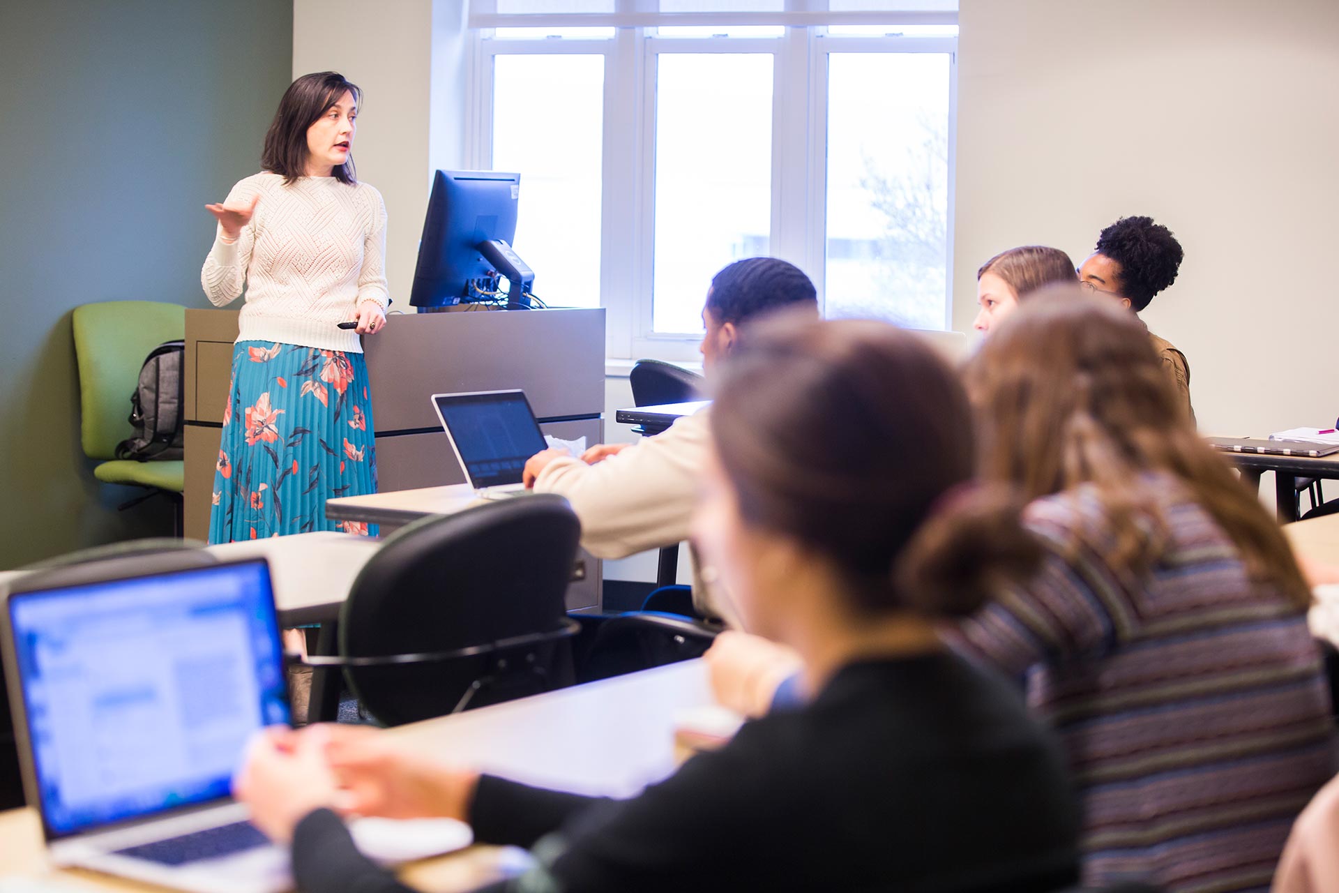 Photo of classroom with instructor leading discussion